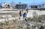 
Boys play at the site of the demolished compound of slain former al-Qaeda leader Osama bin Laden, on February 11, 2021, in northern Abbottabad, Pakistan. [Farooq Naeem/AFP]        