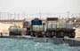 
Trucks deliver aid to Gaza via the newly operational pier constructed by the US military. [CENTCOM]        