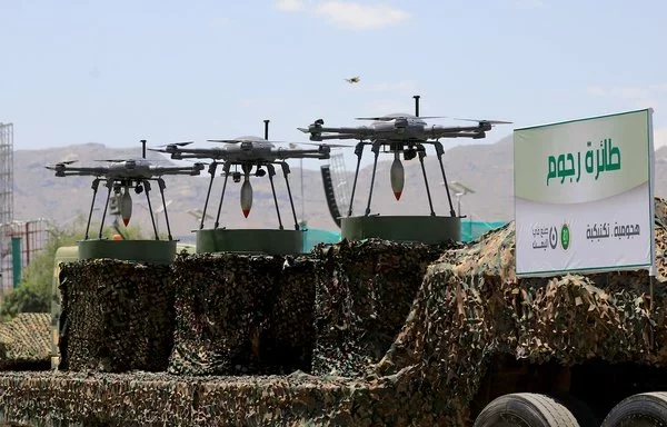 Drones are displayed on the back of a vehicle during a military parade last September 21, marking the ninth anniversary of the Houthis' coup in Sanaa. [Mohammed Huwais/AFP]