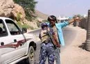 
A member of the Yemeni security forces checks a man at a checkpoint in the former AQAP bastion of al-Mukalla in Yemen's Hadramaut province, on November 30, 2018. [Saleh al-Obeidi/AFP]        