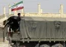 
A Syrian boy holds the Iranian flag atop a truck carrying aid in the eastern city of Deir Ezzor on September 20, 2017. [Louai Beshara/AFP]        