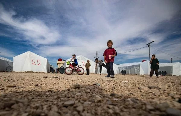 Children play at Roj camp in Syria's al-Hasakeh province, where relatives of suspected members of ISIS are held, on October 8. [Delil Souleiman/AFP]