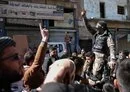 
Demonstrators rally in the Idlib province town of Binnish on March 1 to protest against Tahrir al-Sham. [Oman Haj Kadour/AFP]        