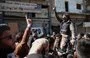 
Demonstrators rally in the Idlib province town of Binnish on March 1 to protest against Tahrir al-Sham. [Oman Haj Kadour/AFP]        