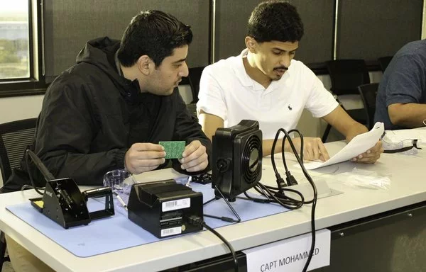 Royal Saudi officers learn about circuit board technology during Electronic Warfare Officer training in 2023 at a US military base in Texas. [US Air Force]