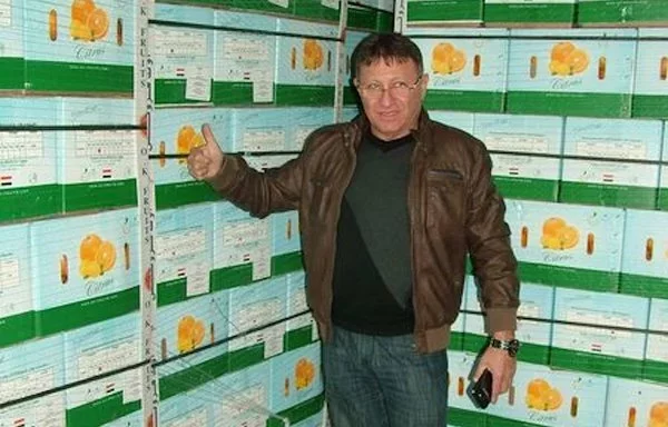 Businessman Ziv Kipper, who was murdered in Alexandria, is seen with crates of Egyptian exports in a social media post from November 20, 2013. [Ziv Kipper Facebook account]