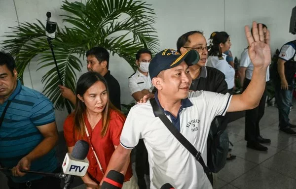 A Filipino crew member of M/V Tutor arrives at the airport in Pasay, Metro Manila, June 17. The Houthis struck the Tutor with a sea drone off al-Hodeidah June 12. [Jam Sta Rosa/AFP]