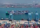 
A cargo ship on May 14 loaded with containers at a port in Qingdao, in China's Shandong province. [AFP]        