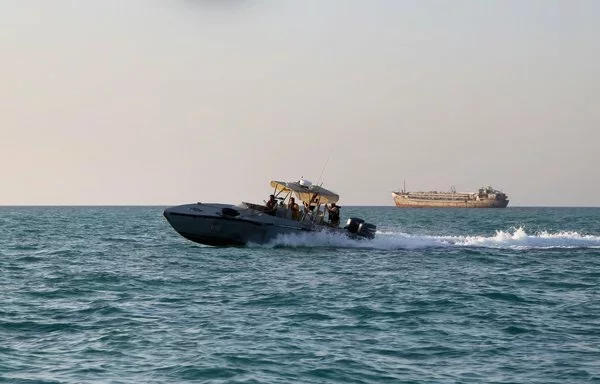 Yemeni coastguardsmen loyal to the internationally recognized government ride a patrol boat in the Red Sea off Mokha, near Bab al-Mandeb, on April 15. [Khaled Ziad/AFP]