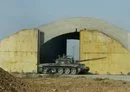 
A Syrian tank is seen outside Dabaa military airport in Homs province June 7, 2013. [STR/AFP]        