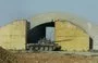 
A Syrian tank is seen outside Dabaa military airport in Homs province June 7, 2013. [STR/AFP]        