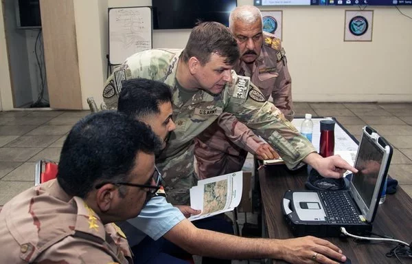 US and Iraqi military personnel work together during a training in June in Iraq. [Operation Inherent Resolve]