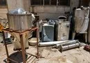 
Confiscated Captagon pill manufacturing instruments are seen at the Zahle judicial police headquarters in Lebanon's Bekaa Valley on July 21, 2022. [Joseph Eid/AFP]        