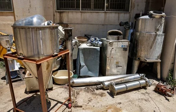 Confiscated Captagon pill manufacturing instruments are seen at the Zahle judicial police headquarters in Lebanon's Bekaa Valley on July 21, 2022. [Joseph Eid/AFP]