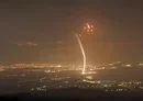 
Rockets fired from southern Lebanon are intercepted by Israel's Iron Dome air defense system over the Upper Galilee region in northern Israel on July 15, amid ongoing cross-border clashes between Israeli troops and Hizbullah fighters. [Jalaa Marey/AFP]        