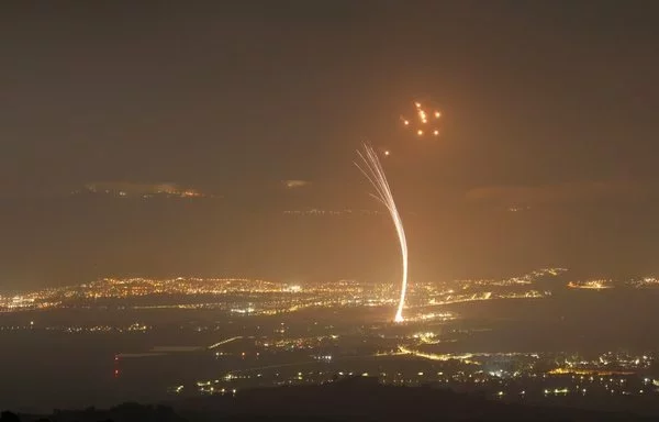 Rockets fired from southern Lebanon are intercepted by Israel's Iron Dome air defense system over the Upper Galilee region in northern Israel on July 15, amid ongoing cross-border clashes between Israeli troops and Hizbullah fighters. [Jalaa Marey/AFP]