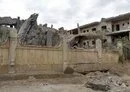 
A photo taken March 26 shows a damaged building following an air strike in Deir Ezzor city that killed at least nine pro-Iran fighters, including an IRGC commander. [AFP]        