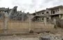 
A photo taken March 26 shows a damaged building following an air strike in Deir Ezzor city that killed at least nine pro-Iran fighters, including an IRGC commander. [AFP]        