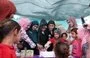 
Iraqi Minister of Migration and Displacement Evan Gabro slices a cake with girls at al-Jadaa Rehabilitation Center near Mosul on March 9. [Evan Gabro X account]        