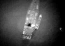 
Aerial photographs taken recently purportedly show a rendezvous between a large Russian ship and smaller Houthi boats, which then ferried crates to shore. [US Government]        