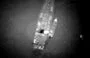 
Aerial photographs taken recently purportedly show a rendezvous between a large Russian ship and smaller Houthi boats, which then ferried crates to shore. [US Government]        