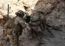 
Iraqi soldiers storm an ISIS hideout in their country's north on June 22. [Iraqi Counter-Terrorism Service]        