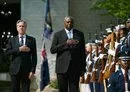 
US Secretary of State Antony Blinken and Defense Secretary Lloyd Austin take part in a ceremony at the US Naval Academy on August 6. [Drew Angerer/AFP]        