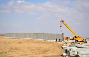 Iraq-Syria border wall closes gaps exploited by ISIS, smugglers