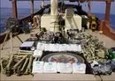 
US forces display arms and lethal aid from Iran they seized from a vessel in the Arabian Sea, en route to the Houthis, on January 28. [CENTCOM]        