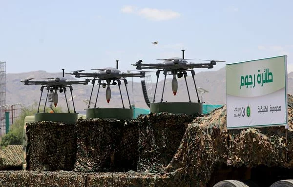 Houthi drones are displayed on the back of a vehicle during an official military parade in Sanaa in September 2023. [Mohammed Huwais/AFP]