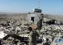 
Yemeni soldiers gather at the site of an al-Qaeda suicide attack that killed three policemen in al-Bayda province March 13, 2012. [AFP]        