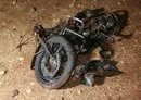 
A picture shows the remains of a motorcycle ridden by a Hurras al-Deen leader which was targeted in a 'kinetic strike' on the eastern edge of Syria's Idlib province on June 28, 2022. Hurras al-Deen is an al-Qaeda affiliate. [Omar Haj Kadour/AFP]        