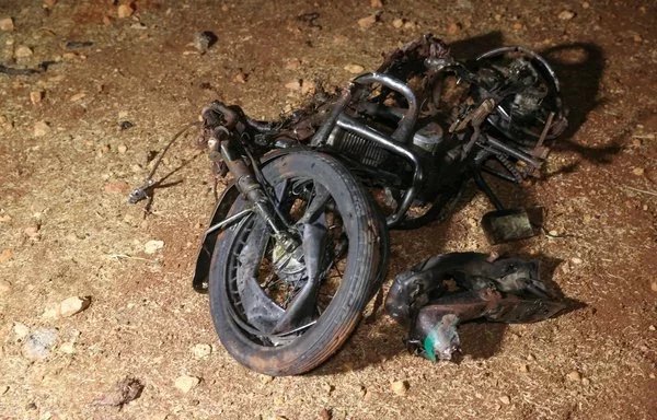 A picture shows the remains of a motorcycle ridden by a Hurras al-Deen leader which was targeted in a 'kinetic strike' on the eastern edge of Syria's Idlib province on June 28, 2022. Hurras al-Deen is an al-Qaeda affiliate. [Omar Haj Kadour/AFP]