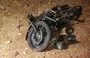 
A picture shows the remains of a motorcycle ridden by a Hurras al-Deen leader which was targeted in a 'kinetic strike' on the eastern edge of Syria's Idlib province on June 28, 2022. Hurras al-Deen is an al-Qaeda affiliate. [Omar Haj Kadour/AFP]        