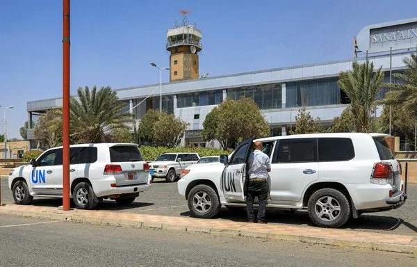 United Nations vehicles are parked outside Sanaa International Airport on June 8, 2022. [Alaa Mohammad/AFP]