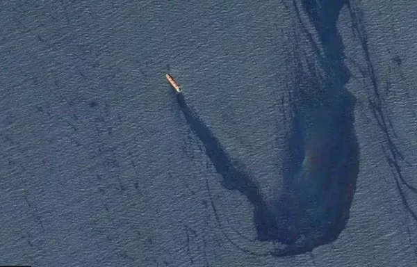 A miles-long oil slick streams from the MV Rubymar, a Belize-flagged, UK-owned bulk carrier, after it was attacked in the Red Sea by the Houthis on February 18. The vessel, which later sank, was transporting over 41,000 tons of fertilizer. [CENTCOM]