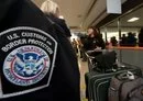 
An international air traveler presents her declarations to a US Customs and Border Protection Officer in this photo from December 21, 2011. [Paul J. Richards/AFP]        