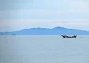 
Fishermen sail near Zuqar island off Yemen's al-Hodeidah, May 3, 2021. [Khaled Ziad/AFP]        