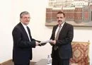 
New Iranian ambassador to Sanaa Ali Mohammed Ramadani (L) presents his credentials to Houthi official Jamal Amer on August 27. The appointment is highly irregular as Iran is the only country that recognizes the Houthis' illegitimate government. [Social media]        