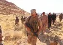 
Iraqi commanders inspect the site of the joint US-Iraqi raid on ISIS strongholds in Wadi al-Qadhf, September 1. [Iraqi Security Media Cell]        