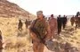 
Iraqi commanders inspect the site of the joint US-Iraqi raid on ISIS strongholds in Wadi al-Qadhf, September 1. [Iraqi Security Media Cell]        