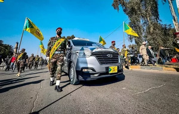 Kataib Hizbullah elements hold a funeral procession for one of their leaders in Baghdad on February 8. [Social media]