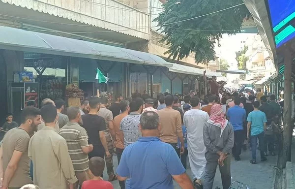 Idlib province residents demonstrate against Tahrir al-Sham on August 23. [Idlib Baladna Facebook page]