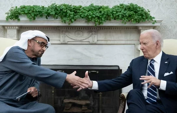 US President Joe Biden shakes hands with President Sheikh Mohamed bin Zayed al-Nahyan of the United Arab Emirates in the Oval Office of the White House in Washington, DC, on September 23. [Brendan Smialowski/AFP]