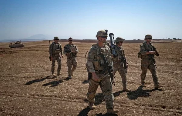 US soldiers during a joint military exercise between international coalition forces and members of the Syrian Democratic Forces in Syria's al-Hasakah province on September 7, 2022. [Delil Souleiman/AFP]