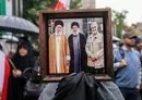 
A demonstrator in Tehran holds a photo of Iranian leader Ali Khamenei, late Hizbullah leader Hassan Nasrallah, and late IRGC Quds Force commander Qassem Soleimani, on September 28. [Atta Kenare/AFP]        