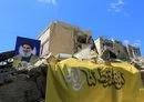 
A picture taken October 2 shows portraits of slain Hizbullah leader Hassan Nasrallah on the rubble of a building in Beirut's southern suburb. [AFP]        