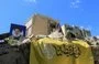 
A picture taken October 2 shows portraits of slain Hizbullah leader Hassan Nasrallah on the rubble of a building in Beirut's southern suburb. [AFP]        