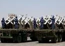 
Houthi fighters stand on a missile carrier during a September 21, 2023 military parade in Sanaa. [Mohammed Huwais/AFP]        