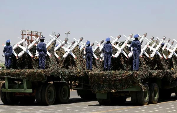 Houthi fighters stand on a missile carrier during a September 21, 2023 military parade in Sanaa. [Mohammed Huwais/AFP]